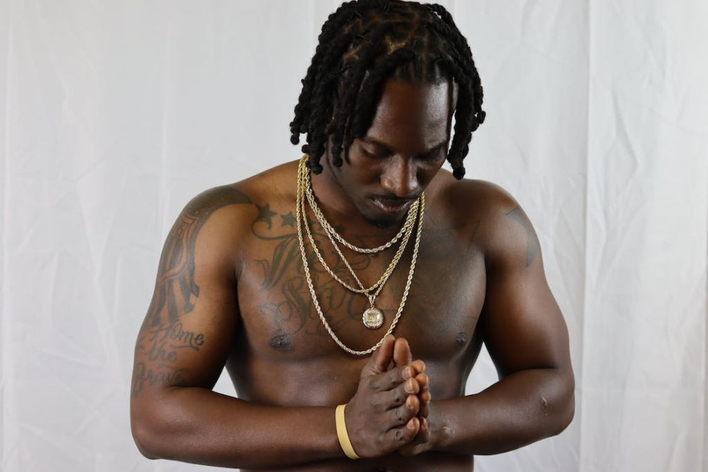 Shirtless man praying